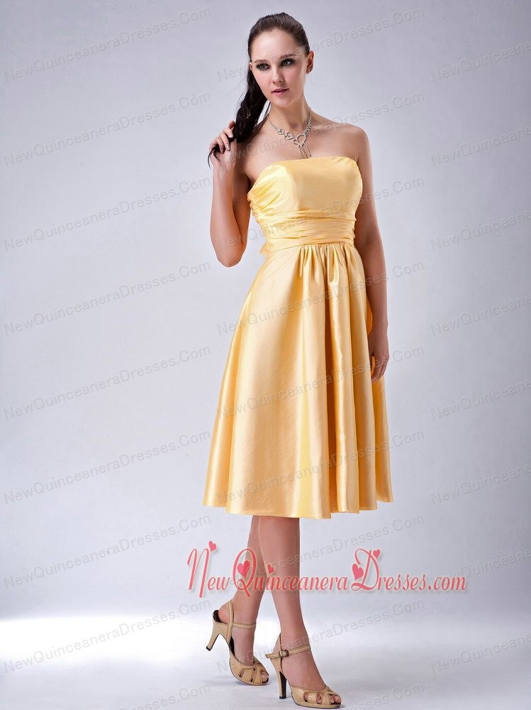 dama dresses gold